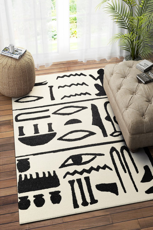 BLACK AND IVORY TRIBAL HAND TUFTED CARPET